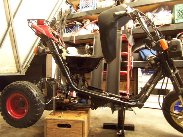 Stand in front  Box w/ the tube I made . now I can get both front and rear tires off the ground